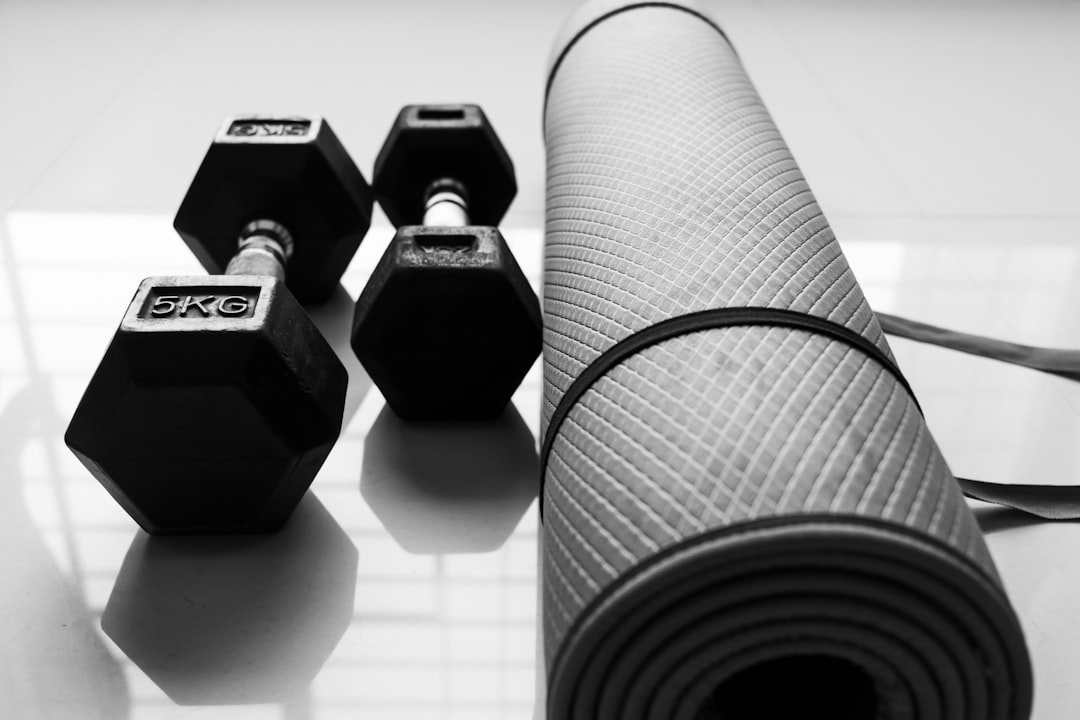 Two Dumbbells and exercise mattress on the floor